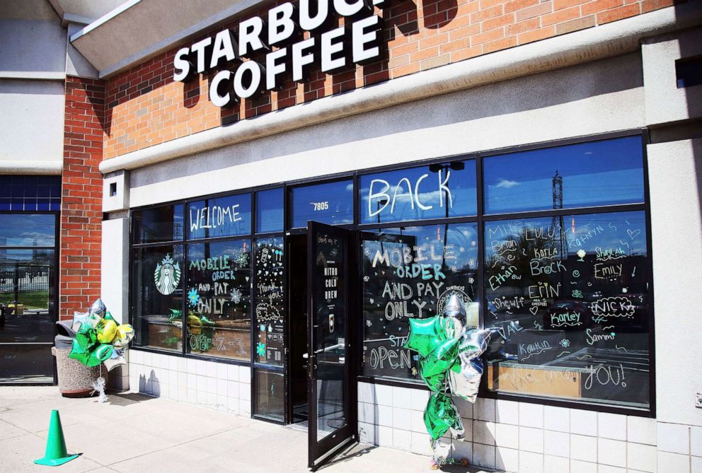 PHOTO: The Southtown Starbucks Coffee business, which was closed March 20, 2020, and reopened late last week, has a "WELCOME BACK" to customers on the windows, May 11, 2020, in Bloomington, Minn, 