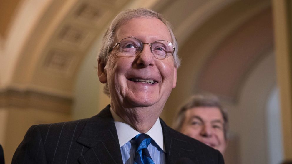 PHOTO: Senate Majority Leader Mitch McConnell, R-Ky., smiles as he meets with reporters as work continues on a plan to keep the government as a funding deadline approaches, in Washington, Feb. 6, 2018.