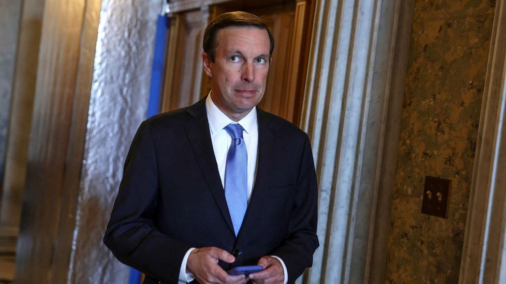 PHOTO: Sen. Chris Murphy looks at his phone outside the Senate floor at the Capitol, May 26, 2022. 
