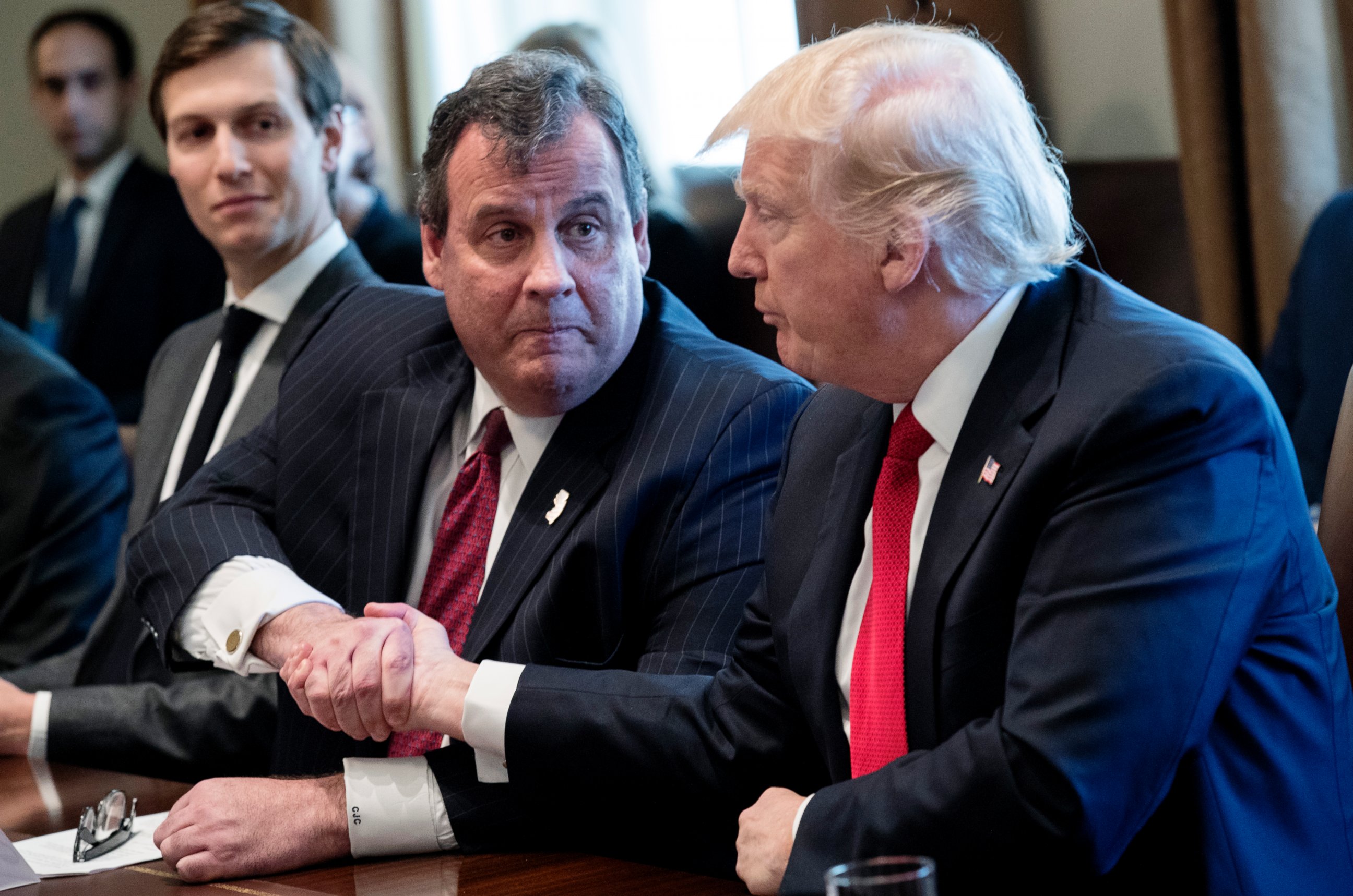 PHOTO: President Donald J. Trump shakes hands with New Jersey Governor Chris Christie , center, during an opioid and drug abuse listening session in the Roosevelt Room of the White House in Washington, March 29, 2017.
