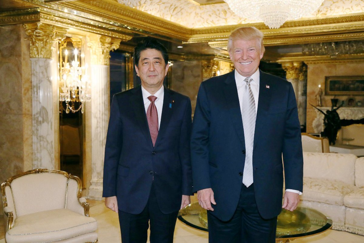 PHOTO: In this photo released by Japan's Cabinet Public Relations Office, Japanese Prime Minister Shinzo Abe, left, and U.S. President-elect Donald Trump, right, pose for a photo during a meeting at Trump Tower in Manhattan, New York, Nov. 17, 2016.