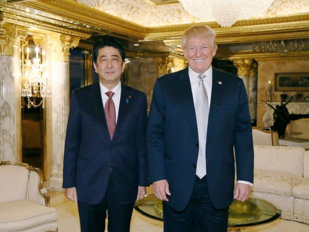 PHOTO: In this photo released by Japans Cabinet Public Relations Office, Japanese Prime Minister Shinzo Abe, left, and U.S. President-elect Donald Trump, right, pose for a photo during a meeting at Trump Tower in Manhattan, New York, Nov. 17, 2016.