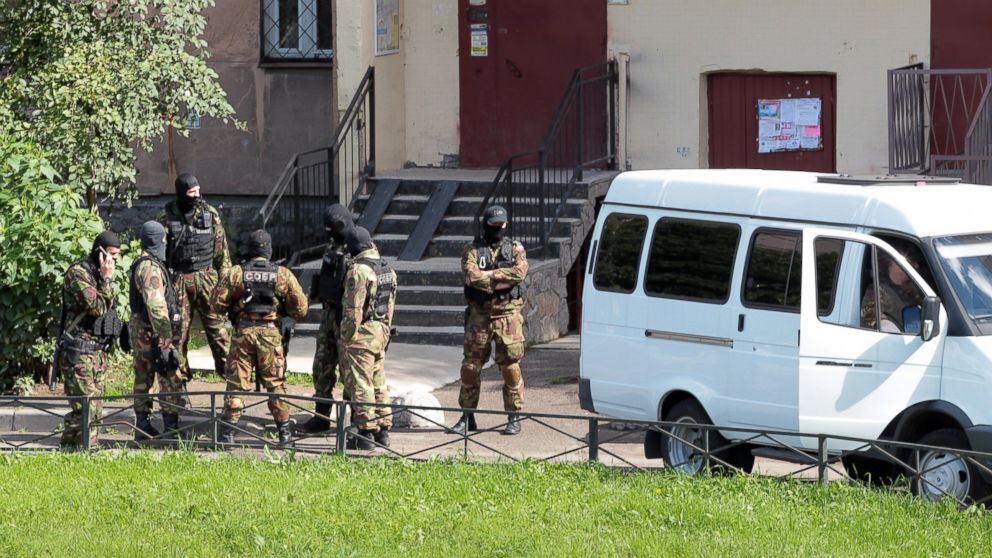 Members of the Special Rapid Response Unit are  seen outside a residential house in Leninsky Avenue during a counterterrorism operation conducted by the Russian Federal Security Service, Aug. 17, 2016.