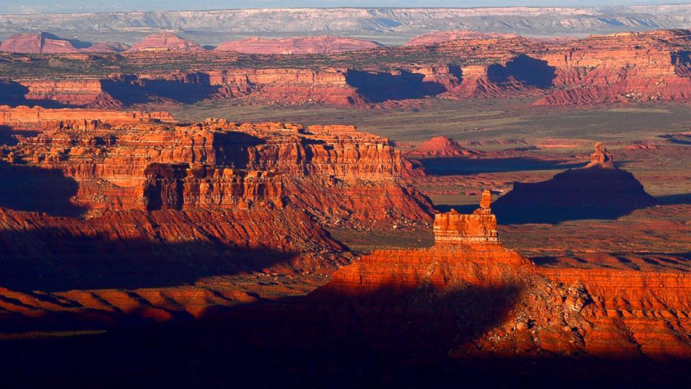 The sun sets over Valley of the Gods in Bears Ears National Monument seen from the Moki Dugway June 11, 2017 north of Mexican Hat, Utah.