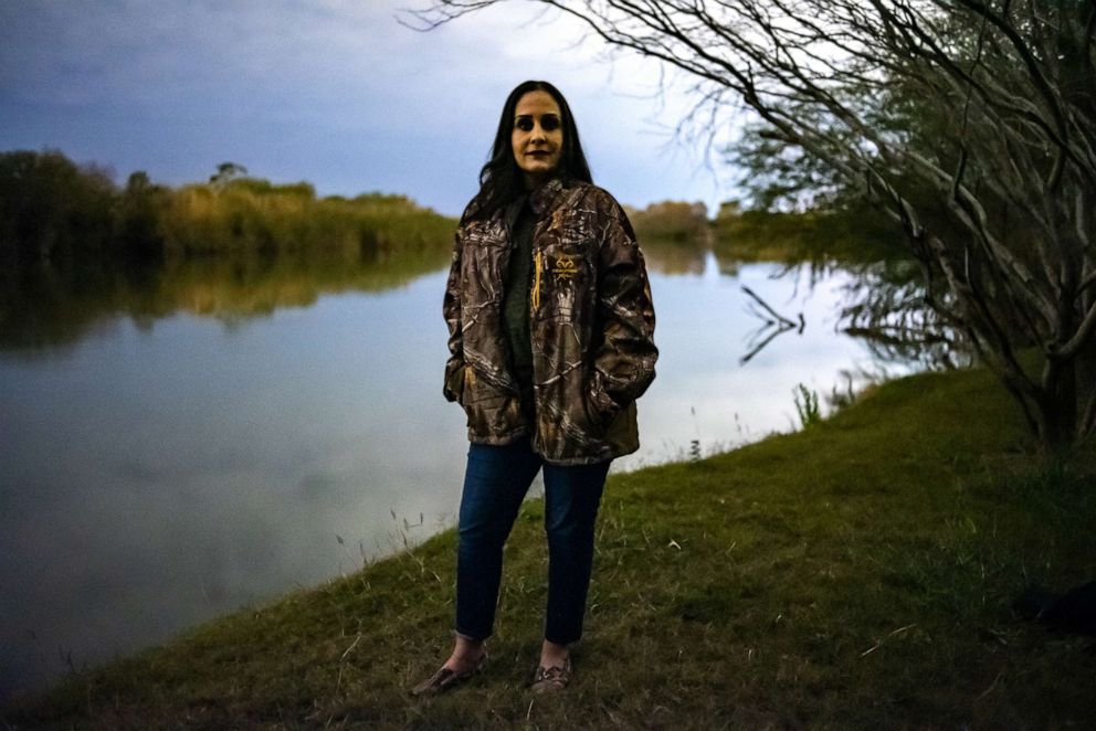 PHOTO: Nayda Alvarez poses for a photo next to the Rio Grande outside her home near Rio Grande City, Texas, Jan. 9 2019. 
