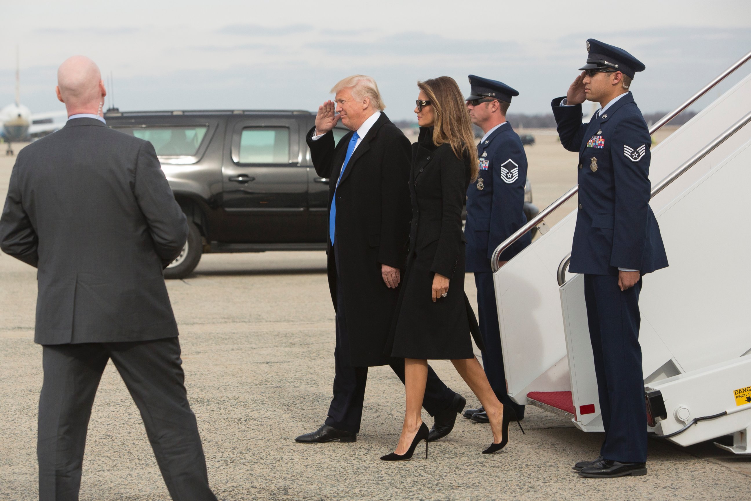 PHOTO: President-elect Donald J. Trump salutes the Air Force stewards, as he and his wife Melania arrive in the Washington, DC area on a US Air Force plane the day before his swearing-in as the 45th President of The United States. 