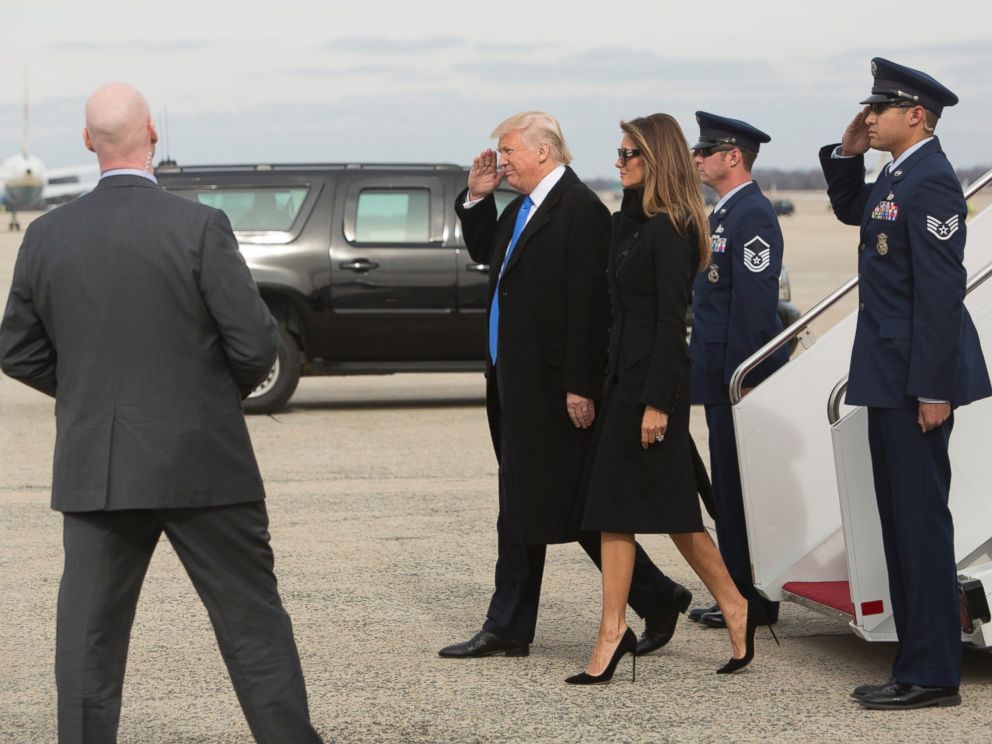 PHOTO: President-elect Donald J. Trump salutes the Air Force stewards, as he and his wife Melania arrive in the Washington, DC area on a US Air Force plane the day before his swearing-in as the 45th President of The United States.