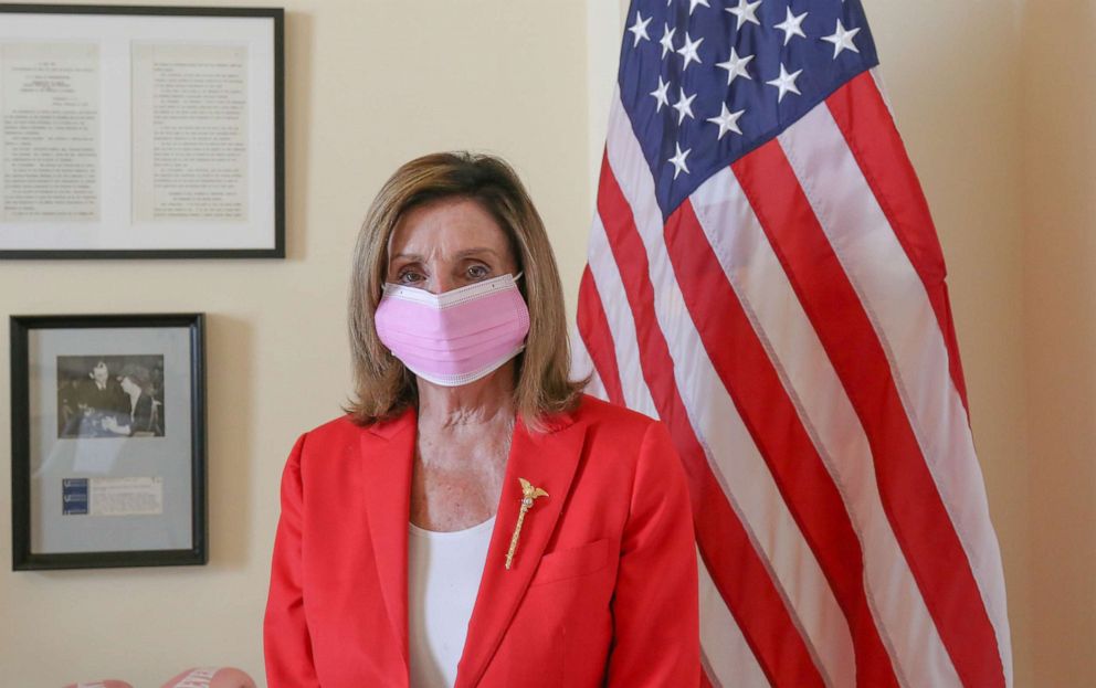 PHOTO: House Speaker Nancy Pelosi poses in a pink mask ahead of a campaign to encourage the use of masks.