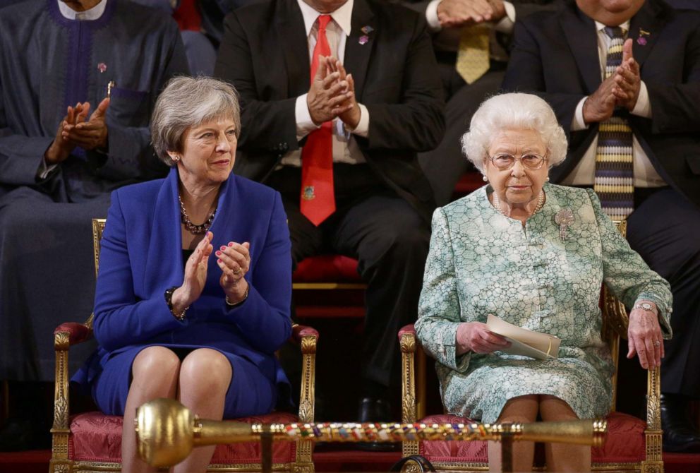 PHOTO: British Prime Minister Theresa May and Queen Elizabeth II attend the formal opening of the Commonwealth Heads of Government Meeting (CHOGM) in the ballroom at Buckingham Palace on April 19, 2018, in London.