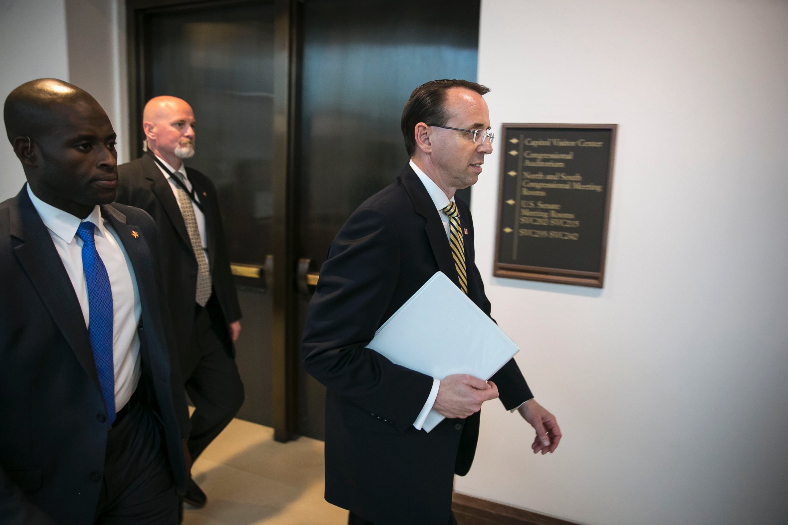PHOTO: Deputy Attorney General Rod Rosenstein, right, following a closed-door meeting with Senators on Capitol Hill, May 18, 2017.