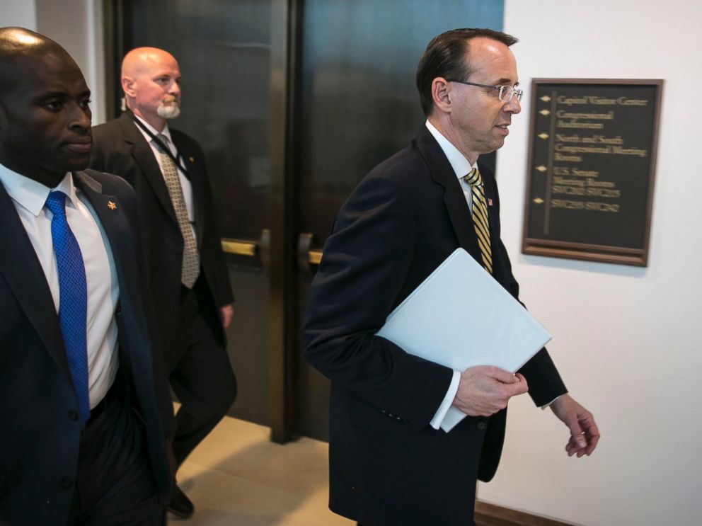 PHOTO: Deputy Attorney General Rod Rosenstein, right, following a closed-door meeting with Senators on Capitol Hill, May 18, 2017.
