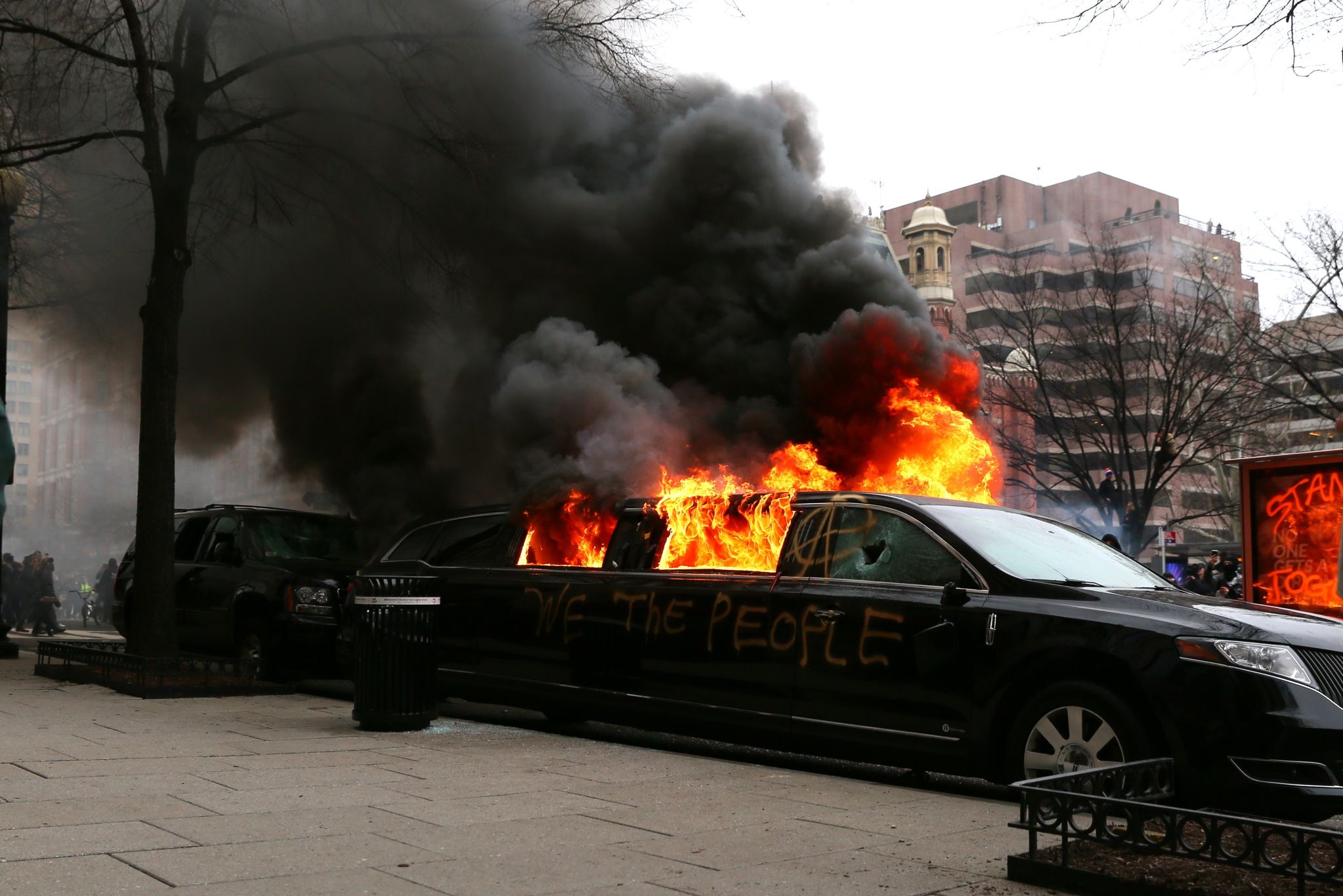 PHOTO: Protesters set fire to a limousine in the street, Jan. 20, 2017, in Washington.