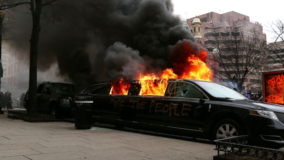 PHOTO: Protesters set fire to a limousine in the street, Jan. 20, 2017, in Washington.