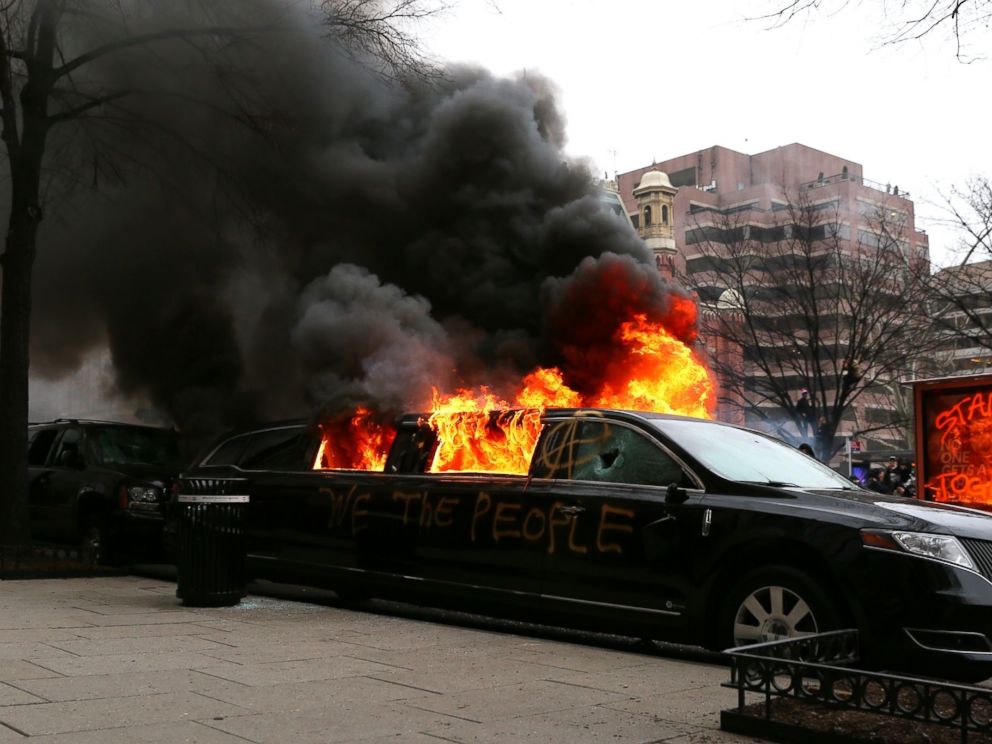 PHOTO: Protesters set fire to a limousine in the street, Jan. 20, 2017, in Washington.