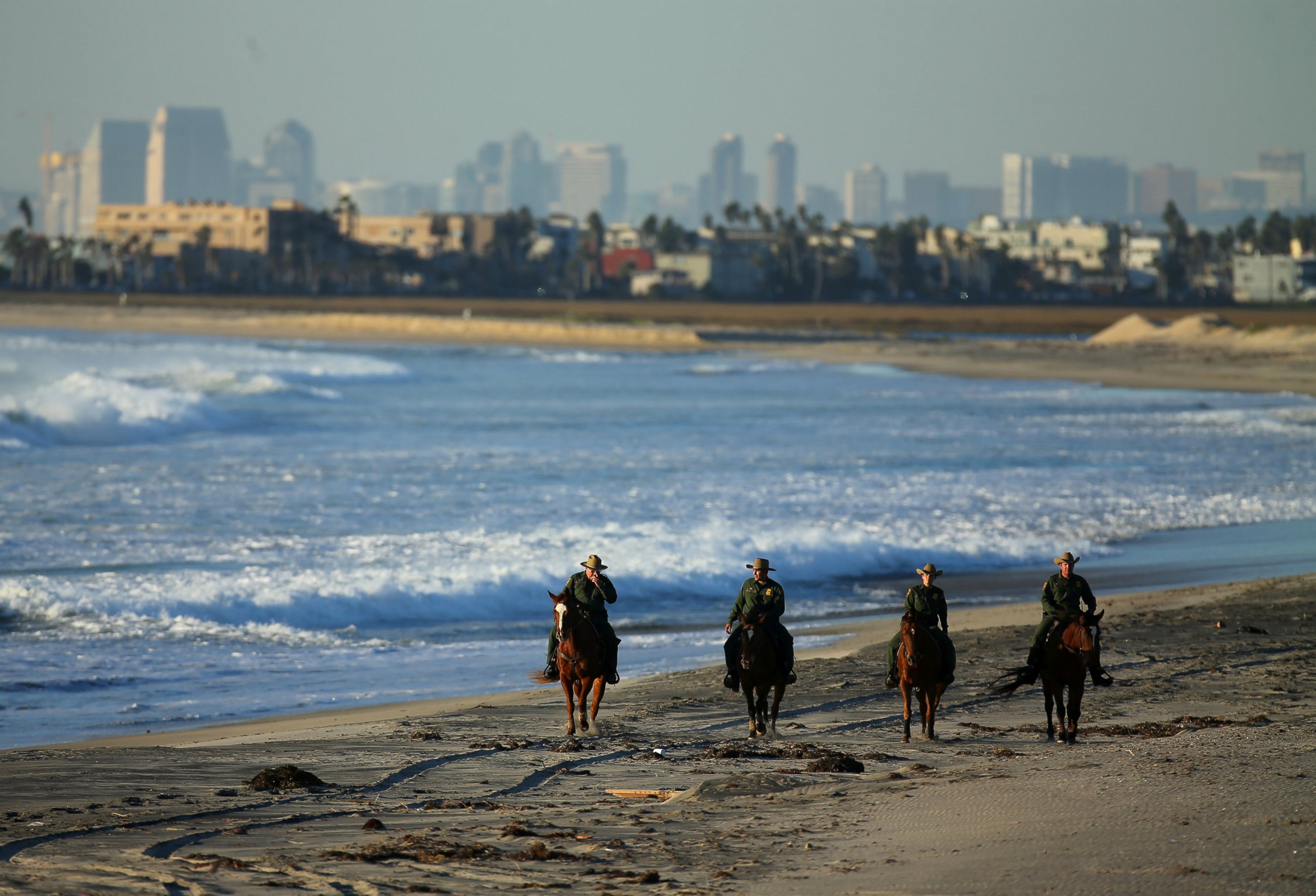 PHOTO: U.S. Border Patrol agents on horseback patrol along a beach just north of the U.S. and Mexico border near San Diego, Calif., Nov. 10, 2016. 