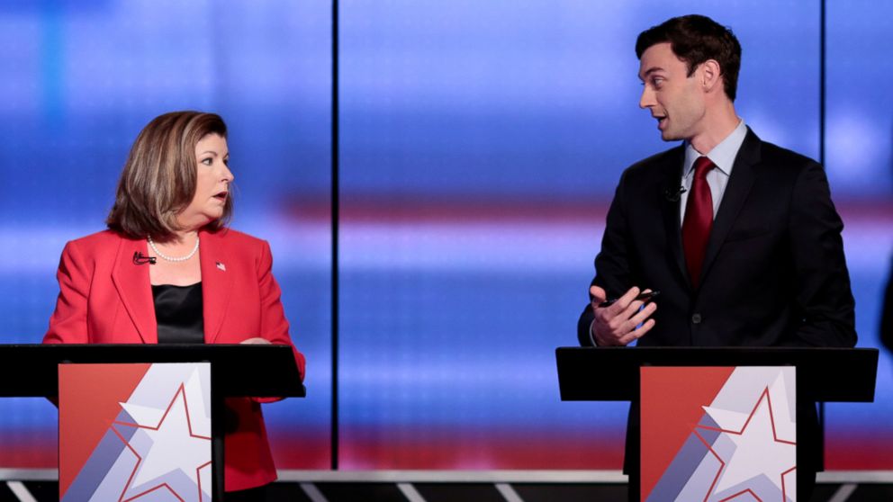 Republican candidate Karen Handel and Democratic candidate Jon Ossoff exchange words before Georgia's 6th Congressional District special election debate at WSB-TV studios in Atlanta, June 6, 2017. 