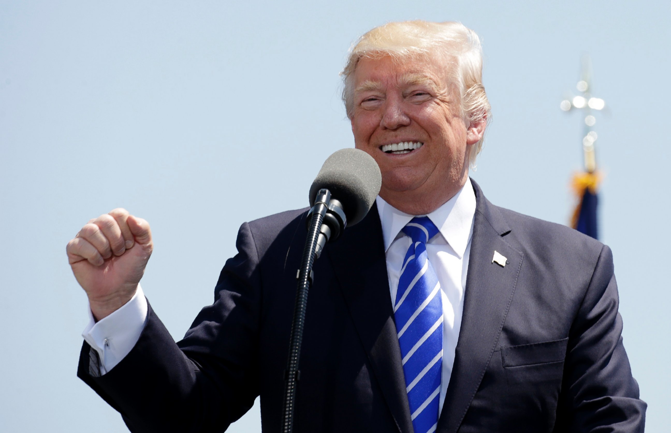 PHOTO: President Donald Trump pumps his fist and smiles as he addresses the graduating class of the U.S. Coast Guard Academy during commencement ceremonies in New London, Conn., on May 17, 2017. 