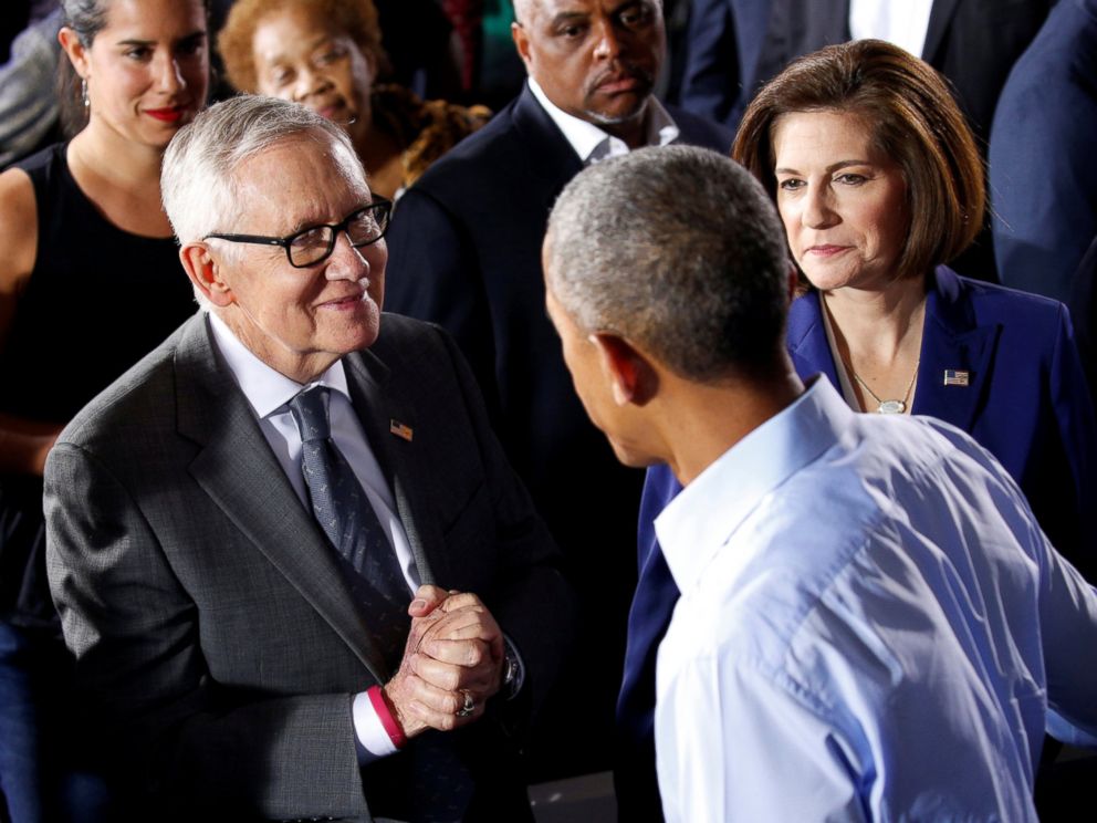 PHOTO: President Barack Obama is greeted by Senate Democratic leader Harry Reid (L) and Senate candidate Catherine Cortez Masto (R) during rally in support of Hillary Clintons campaign in Las Vegas, Oct. 23, 2016.