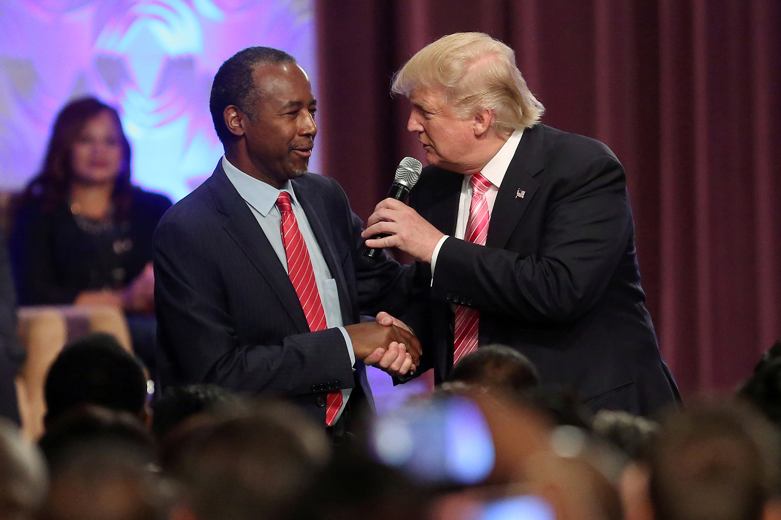PHOTO: Republican presidential nominee Donald Trump shakes hands with Ben Carson as he attends a church service in Detroit, Michigan, Sept. 3, 2016. 