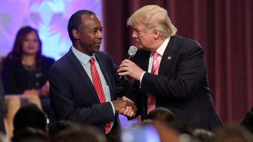 PHOTO: Republican presidential nominee Donald Trump shakes hands with Ben Carson as he attends a church service in Detroit, Michigan, Sept. 3, 2016. 