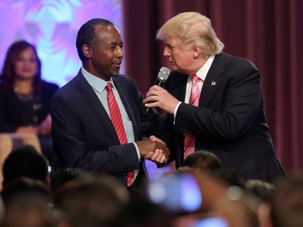 PHOTO: Republican presidential nominee Donald Trump shakes hands with Ben Carson as he attends a church service in Detroit, Michigan, Sept. 3, 2016.