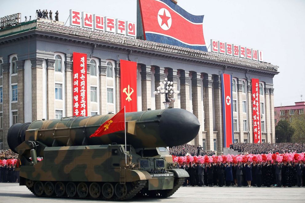 PHOTO: People cheer as a missile is driven past the stand with North Korean leader Kim Jong-un and other high ranking officials during a military parade in Pyongyang, April 15, 2017. 