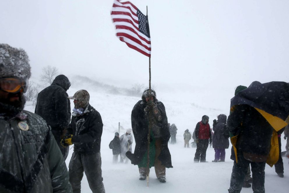 PHOTO: Demonstrators outside the Oceti Sakowin camp oppose plans to pass the Dakota Access pipeline adjacent to the Standing Rock Indian Reservation, near Cannon Ball, North Dakota, Dec. 5, 2016. 