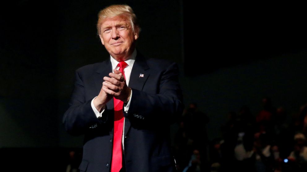 President-elect Donald Trump claps at the USA Thank You Tour event at the Iowa Events Center in Des Moines, Iowa, Dec. 8, 2016.