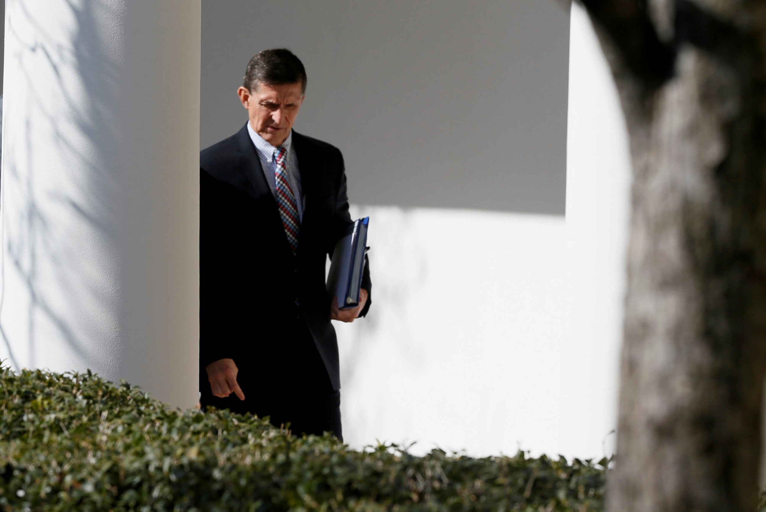 PHOTO: White House National Security Advisor Michael Flynn walks down the White House colonnade on the way to Japanese Prime Minister Shinzo Abe and President Donald Trump's joint news conference at the White House, Feb. 10, 2017.