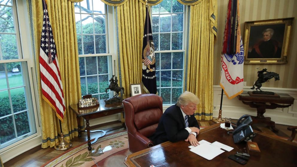 President Donald Trump at his desk in the Oval office during an interview with Reuters, April 27, 2017.