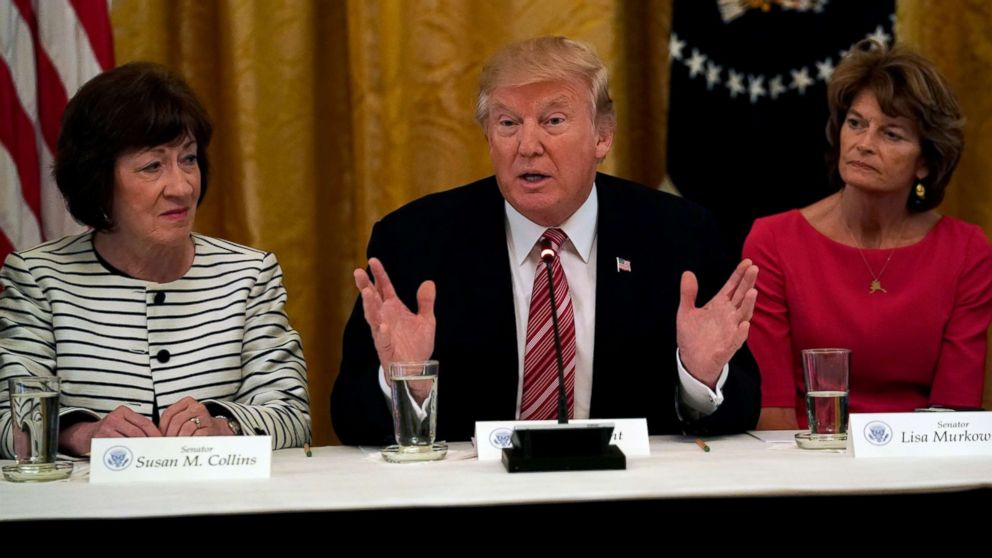 President Donald Trump meets with Senate Republicans about healthcare in the East Room of the White House, June 27, 2017. Trump is flanked by Senators Susan Collins,left, (R-ME) and Sen. Lisa Murkowski,(R-AK).  