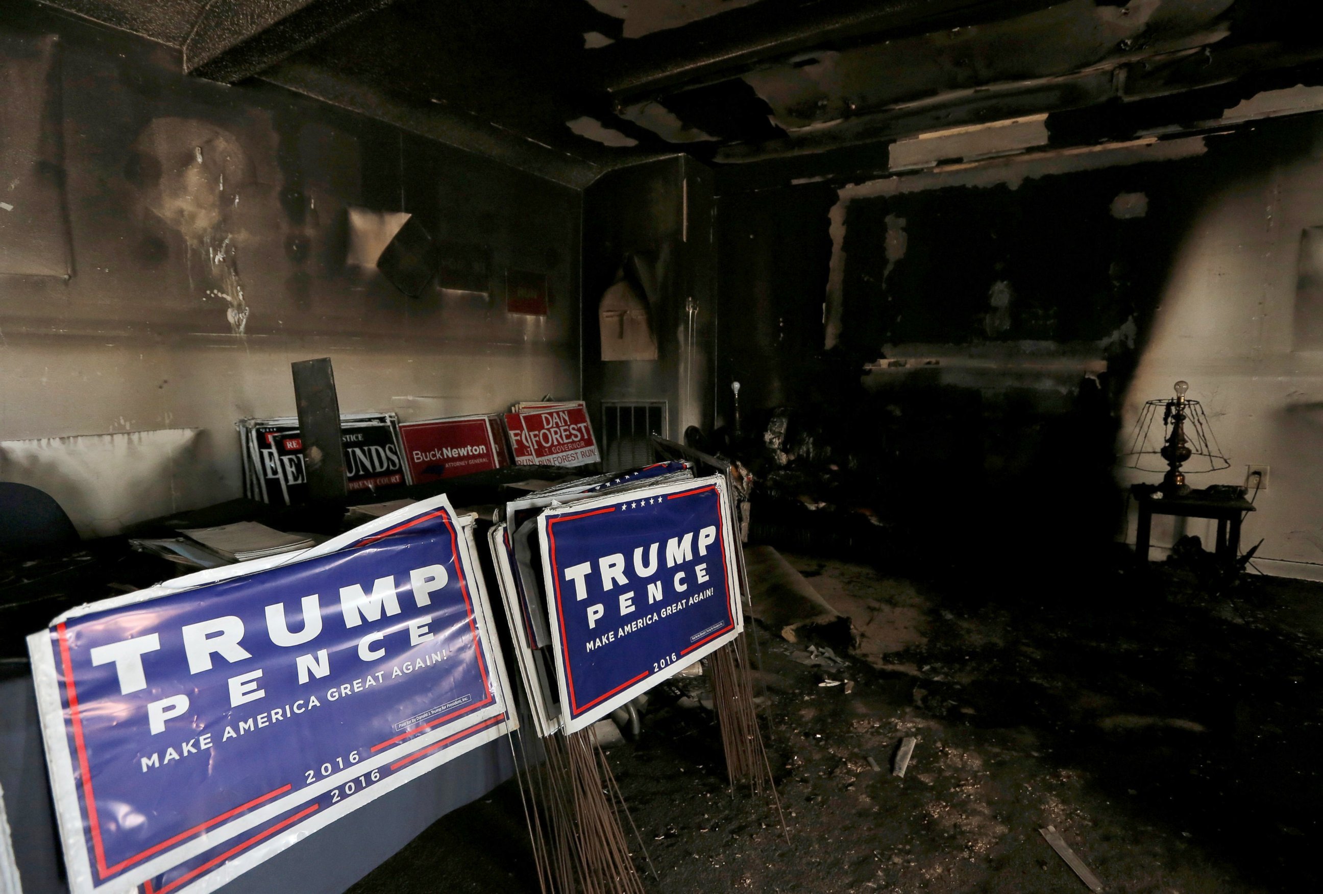 PHOTO: Political signs are seen in the damage caused in a firebomb attack on local offices of the North Carolina Republican Party in Hillsborough, North Carolina, October 17, 2016. 