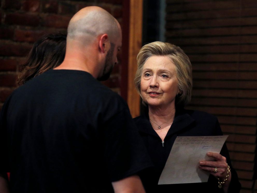 PHOTO: Democratic presidential candidate Hillary Clinton listens to Bo Copley at a campaign event in Williamson, West Virginia,May 2, 2016.     Copley gave Clinton a photo of his children and told her how he lost his job in the mining industry. 