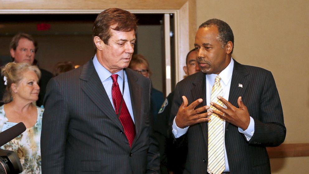 U.S. presidential candidate Donald Trump's senior campaign adviser Paul Manafort (L) walks into a reception with former Republican presidential candidate Dr. Ben Carson, at the Republican National Committee Spring Meeting at the Diplomat Resort on April 21, 2016, in Hollywood, Fla.