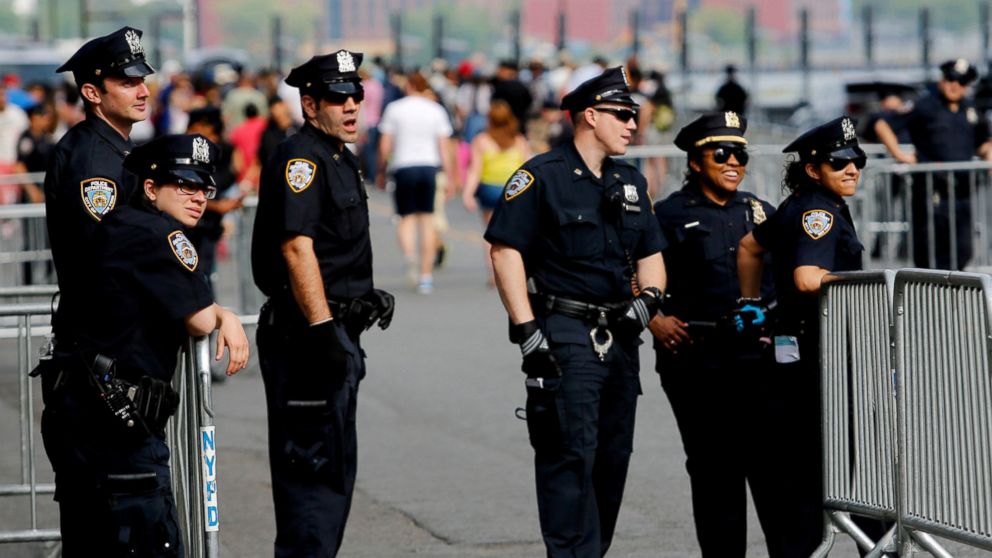 NYPD officers stand guard at the east side before Macy's 4th of July Fireworks Independence Day celebrations, July 4, 2016,in New York City. 