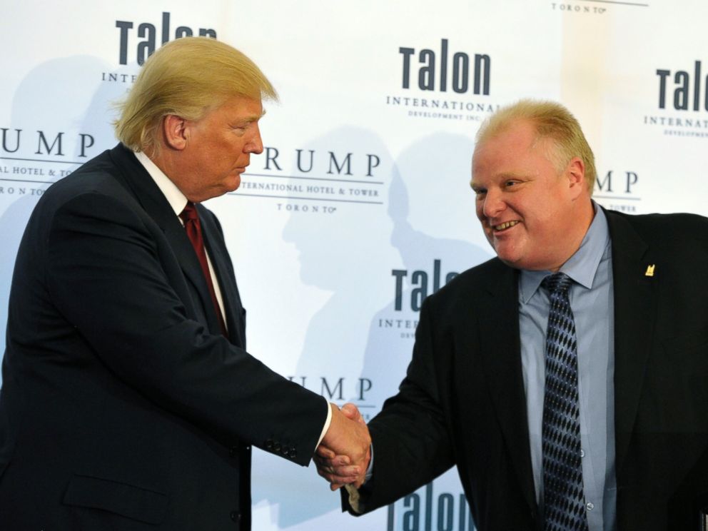 PHOTO: Donald Trump (L) shakes hands with Toronto Mayor Rob Ford during a news conference to mark the opening of the Trump International Hotel & Tower in Toronto on April 16, 2012.    