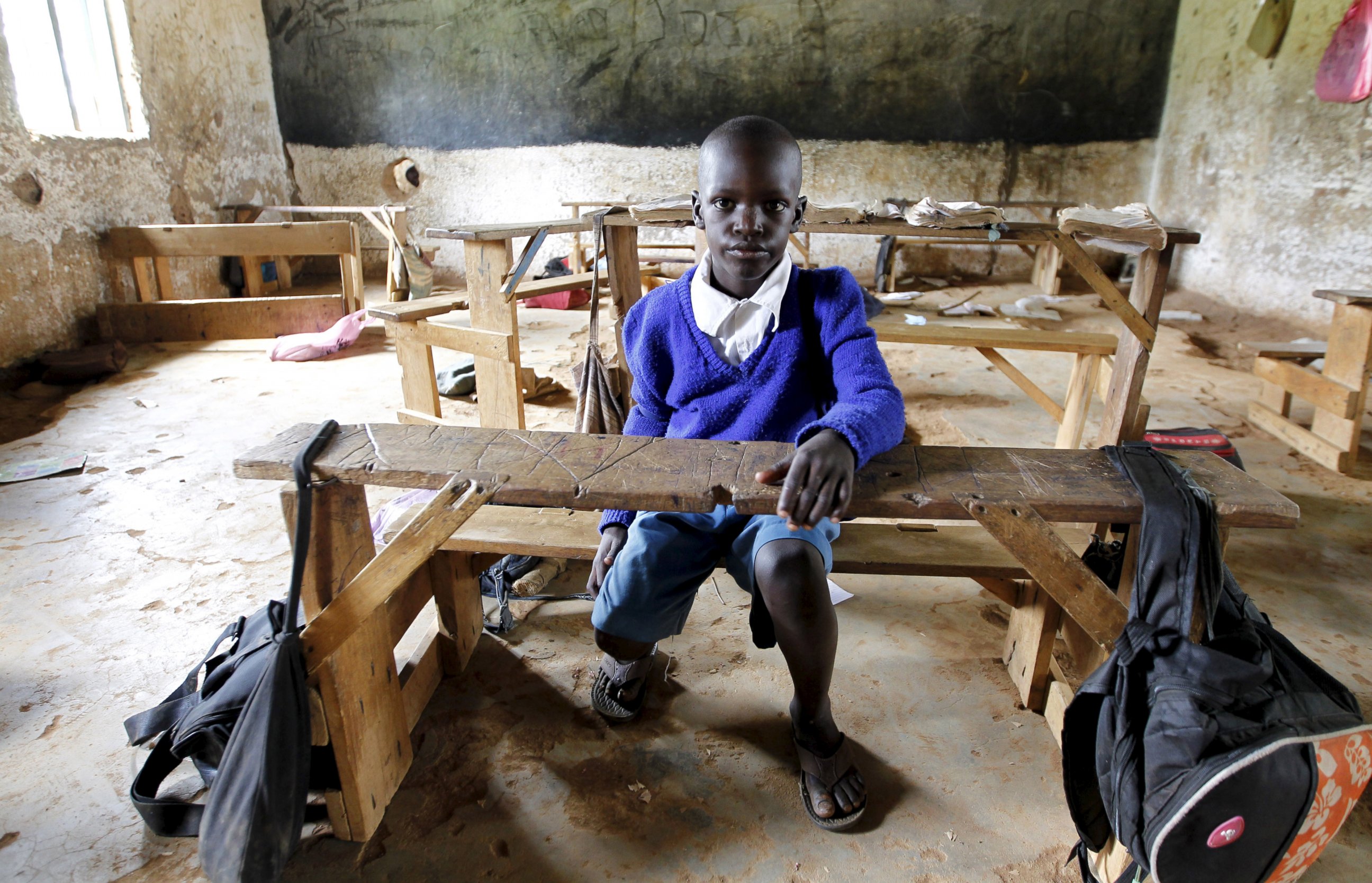 PHOTO: Seven-year-old Barack Obama Okoth, named after President Barack Obama, sits inside an empty classroom as he speaks with Reuters at the Senator Obama primary school in Nyangoma village in Kogelo, west of Kenya's capital Nairobi, June 23, 2015.