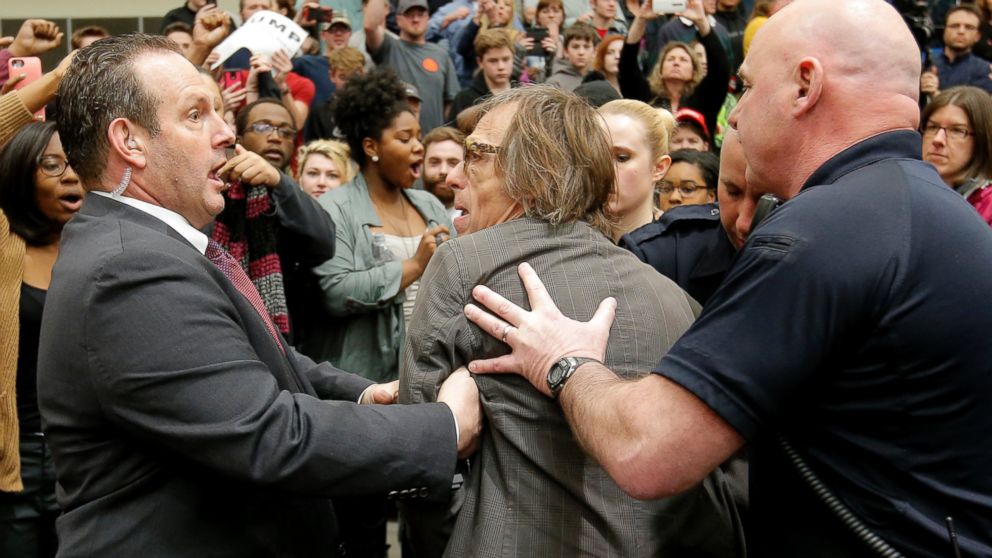 Photographer Christopher Morris is removed by security officials as Donald Trump speaks during a campaign event in Radford, Virginia, Feb. 29, 2016.