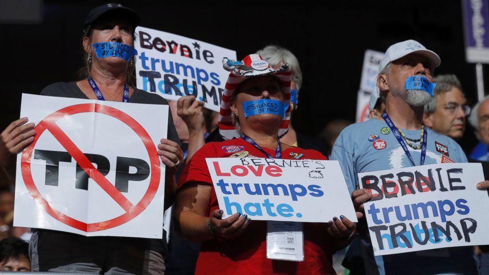 PHOTO: Supporters of Bernie Sanders wear tape across their mouths in protest on the floor at the Democratic National Convention in Philadelphia, July 25, 2016.