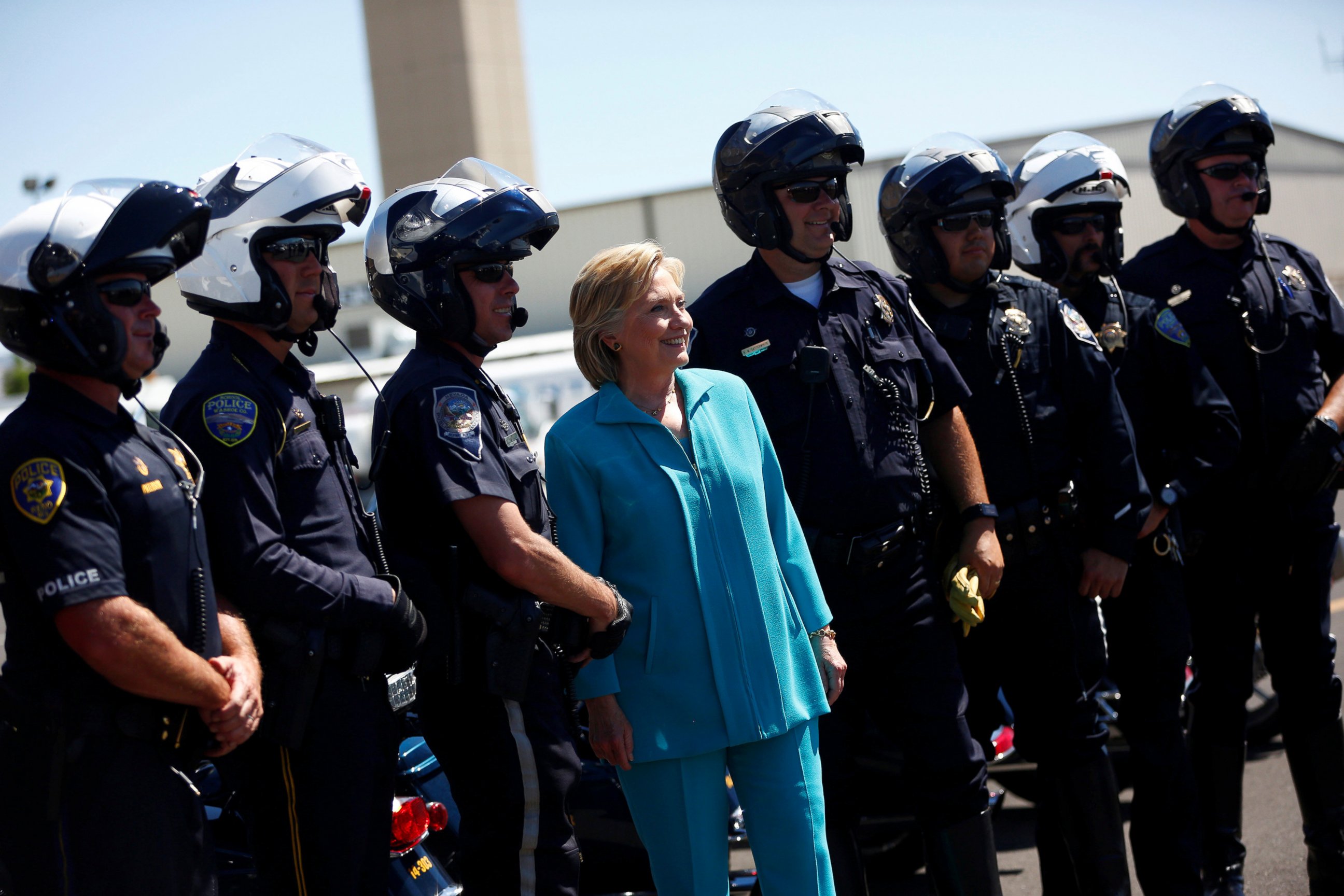 PHOTO: Democratic presidential nominee Hillary Clinton greets police officers at Reno Tahoe International Airport in Reno, Nevada, Aug. 25, 2016.  