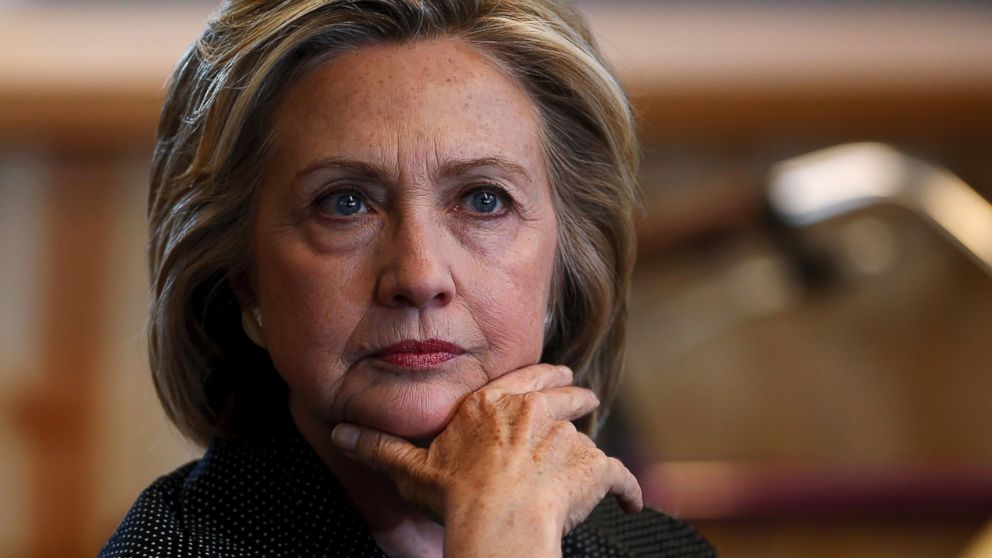 Presidential candidate Hillary Clinton listens to remarks at a roundtable campaign event with small businesses in Cedar Falls, Iowa, May 19, 2015.   