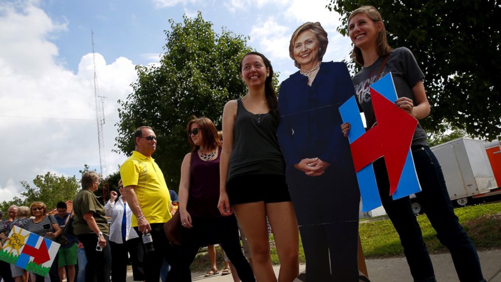 Supporters have their picture taken with a life-sized cutout of Democratic presidential candidate Hillary Clinton at a campaign event in Des Moines, Iowa, June 14, 2015. 