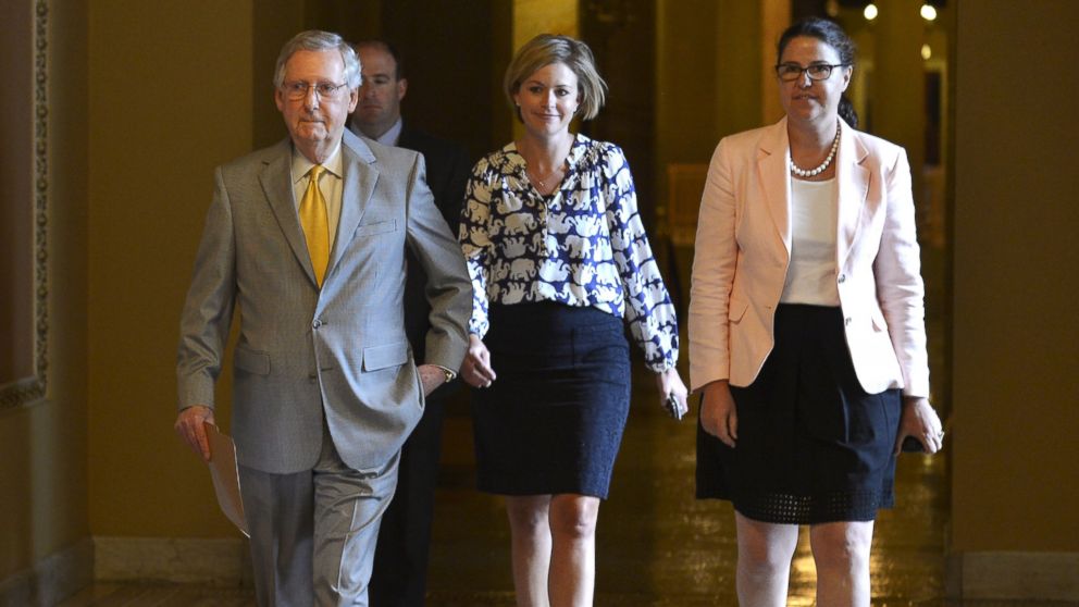 PHOTO: Senate Majority Leader Mitch McConnell, R-KY, left, walks from his office with staff to the floor of the Senate on a rare working Sunday, on Capitol Hill, in Washington, May 31, 2015.
