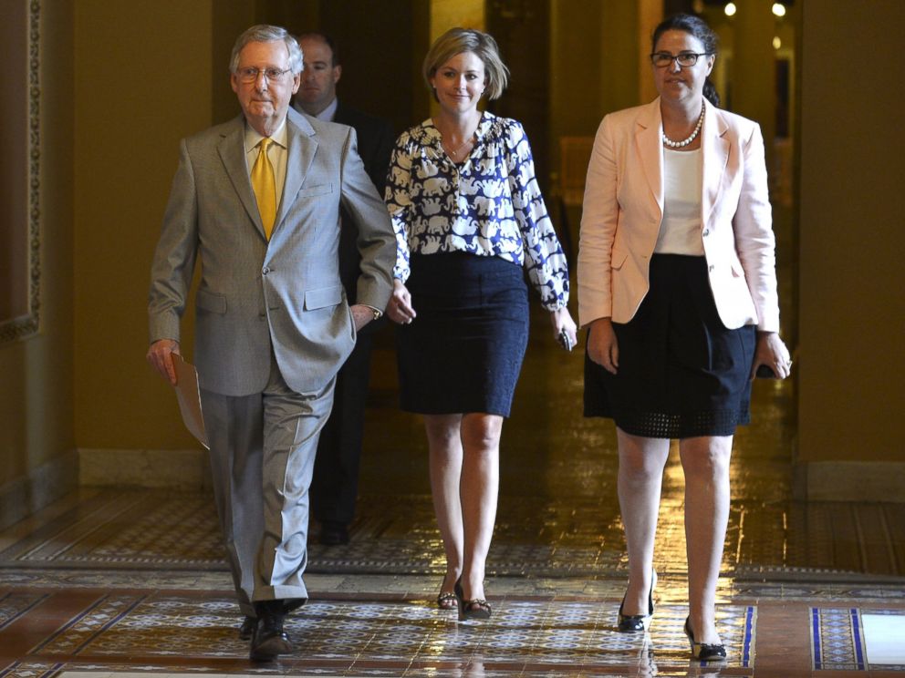 PHOTO: Senate Majority Leader Mitch McConnell, R-KY, left, walks from his office with staff to the floor of the Senate on a rare working Sunday, on Capitol Hill, in Washington, May 31, 2015.