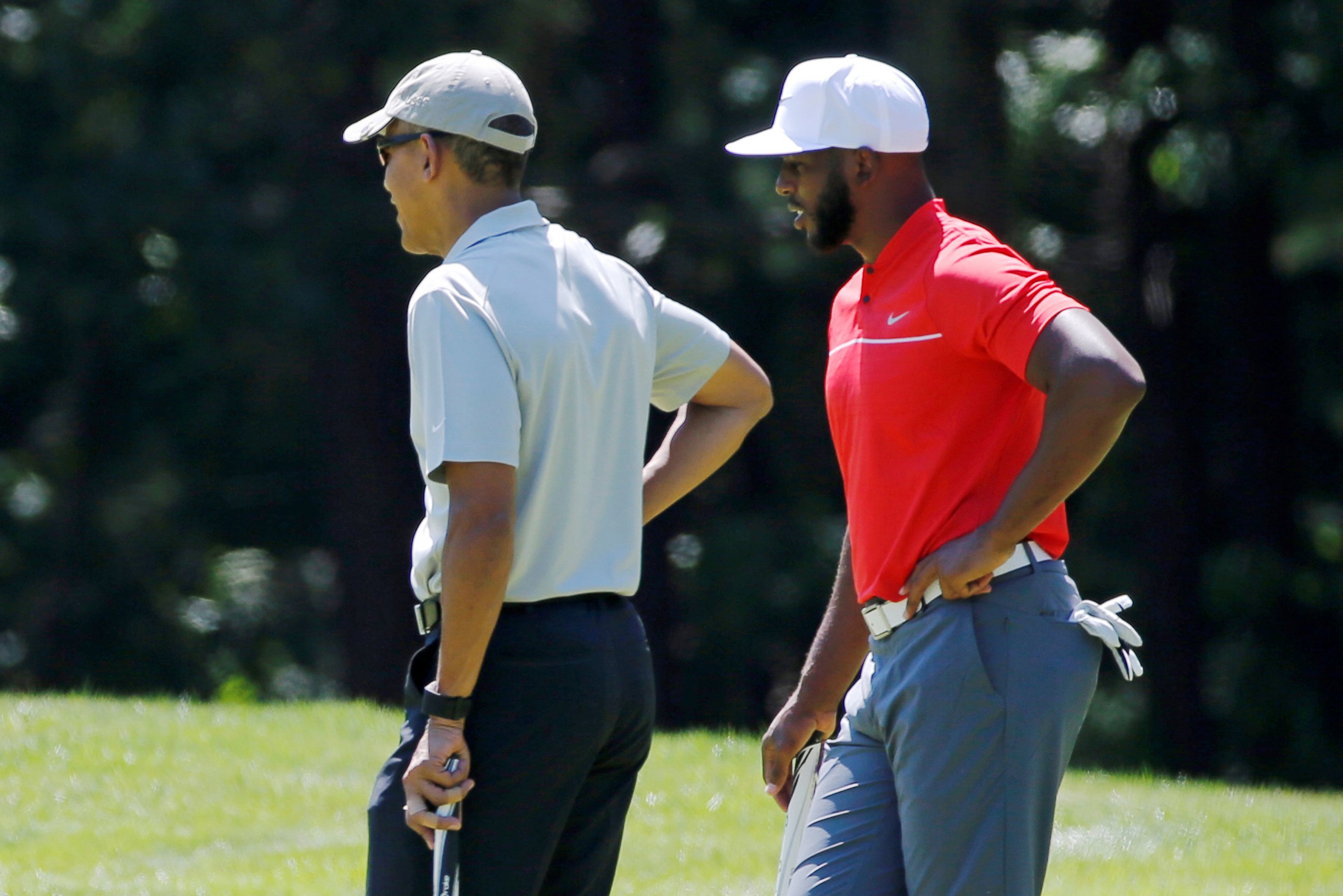 PHOTO: President Barack Obama and NBA basketball player Chris Paul of the Los Angeles Clippers play golf at Farm Neck Golf Club during Obama's annual summer vacation on Martha's Vineyard, in Oak Bluffs, Massachusetts, Aug. 7, 2016.