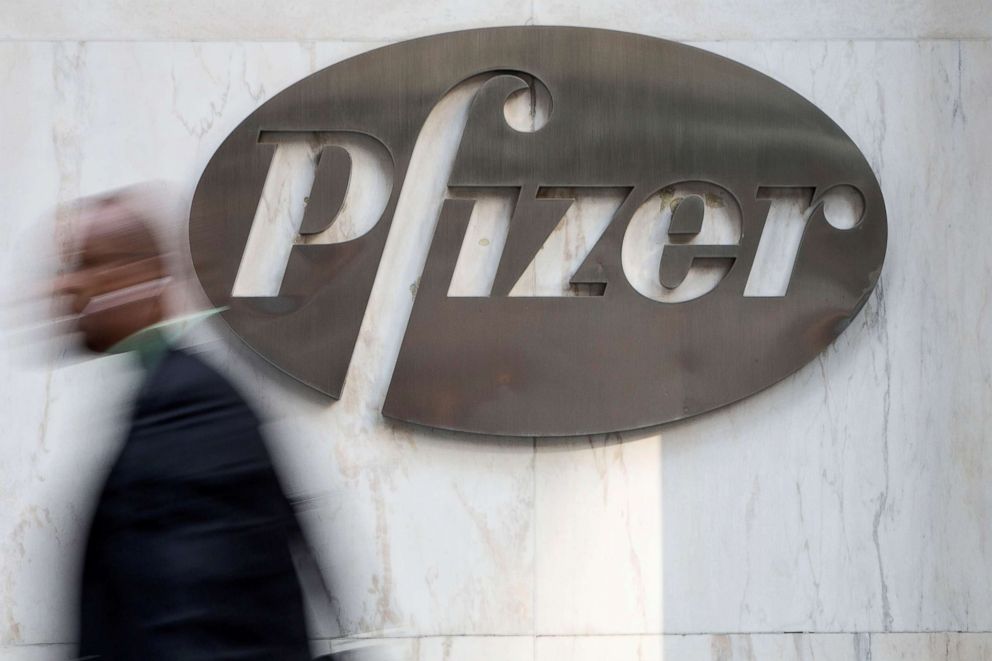 PHOTO: A man walks past Pfizer's world headquarters in New York, April 28, 2014. 