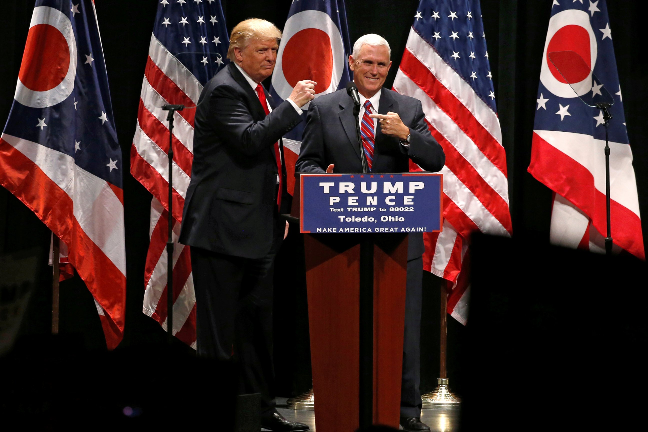 PHOTO: Republican presidential nominee Donald Trump brings vice presidential nominee Mike Pence onstage as he rallies with supporters in Toledo, Ohio, Sept. 21, 2016. 