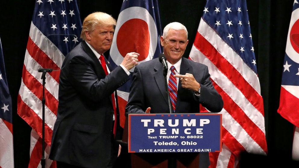 PHOTO: Republican presidential nominee Donald Trump brings vice presidential nominee Mike Pence onstage as he rallies with supporters in Toledo, Ohio, Sept. 21, 2016.