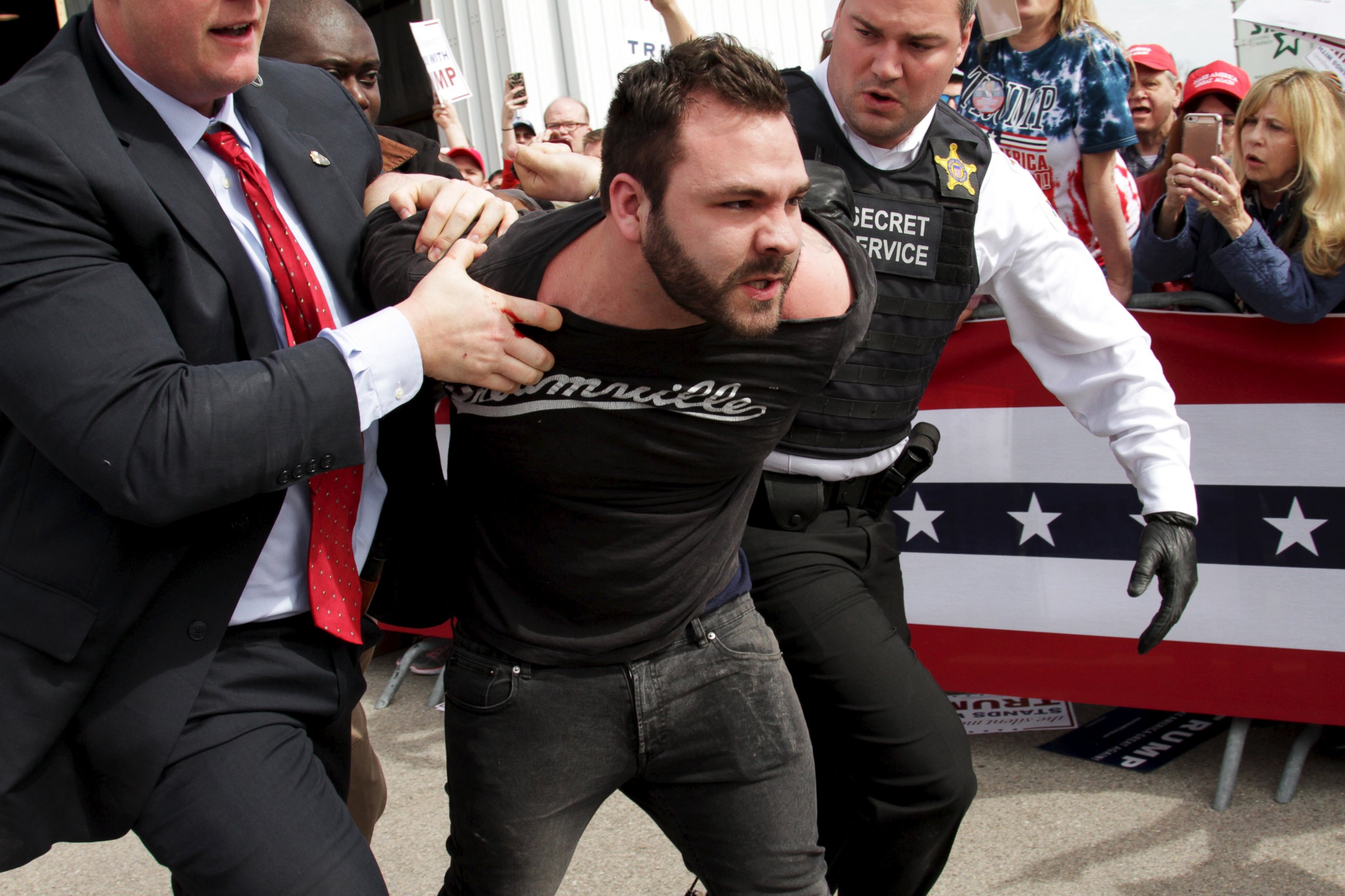 PHOTO: U.S. Secret Service agents detain a man after a disturbance as Republican presidential candidate Donald Trump spoke at Dayton International Airport in Dayton, Ohio, March 12, 2016.  