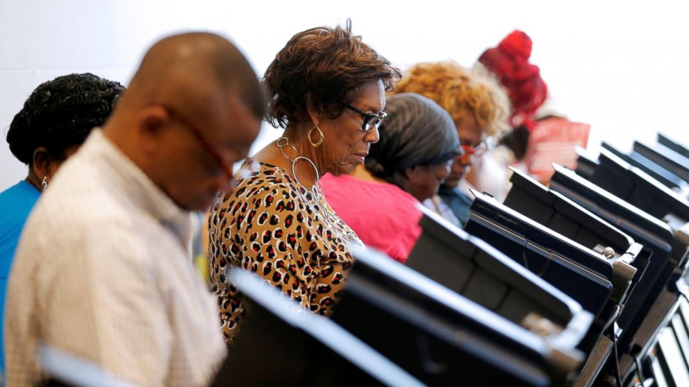 Voters cast their ballots during early voting at the Beatties Ford Library in Charlotte, North Carolina, Oct. 20, 2016. 